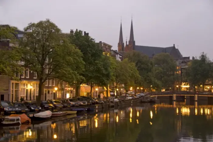 Framed Print : Street lights reflect onto the canal at dusk with a lit bridge and De Krijtberg in Framed Print : Street lights reflect onto the canal at dusk with a lit bridge and De Krijtberg in