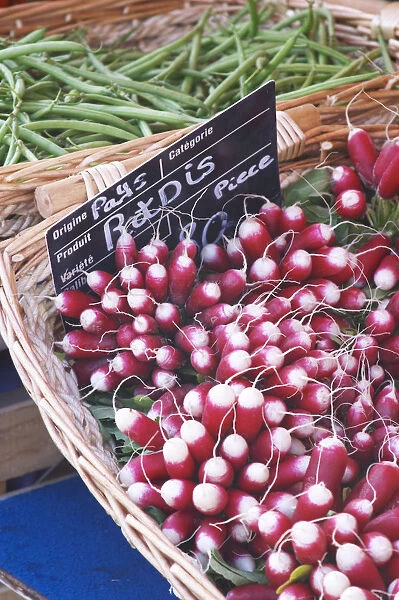 Street market merchants stall with red and white radishes Sanary Var Cote daaAzur