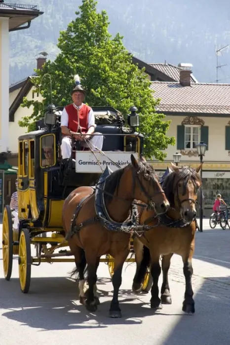 Framed Print : Street scene with a horse drawn stage coach in the alpine village of Garmisch, Germany