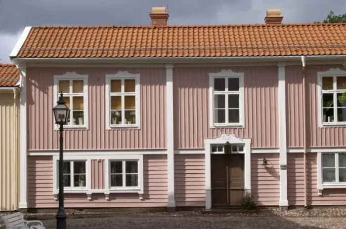 Framed Print : A street scene from the old town where there are many unique old wooden houses. Peder skomakares