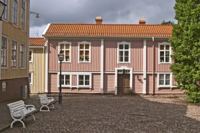 Framed Print : A street scene from the old town where there are many unique old wooden houses. Peder skomakares