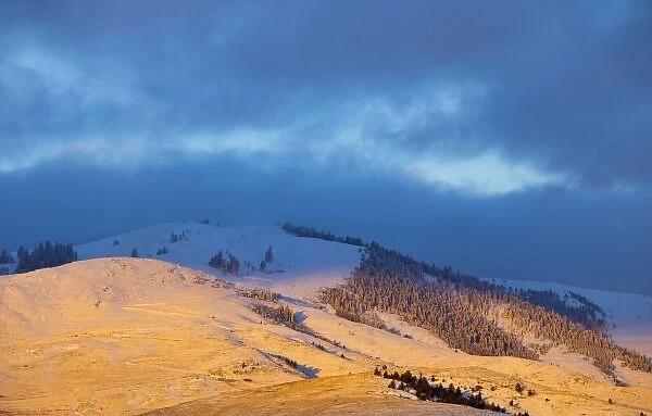 Suinrise light strikes the Moiese Hills at the National Bison Range in the Mission
