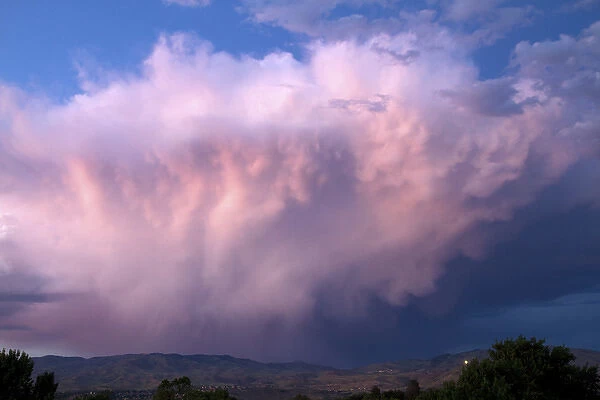 Summer storm cloud at sunset over the foothills near Boise, Idaho, USA
