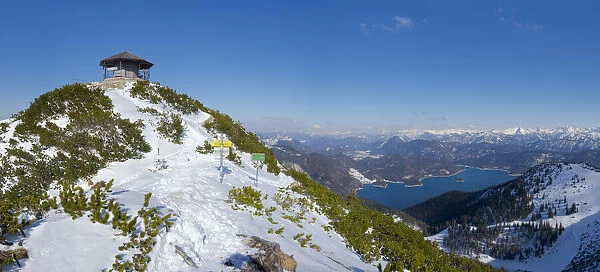 Summit of Mt. Herzogstand with pavilion near lake Walchensee during winter in