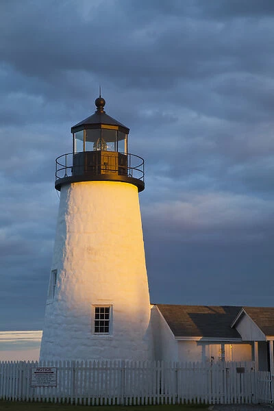 Sun breaks through the clouds at Pemaquid Point Lighthouse in New Harbor, Maine, USA