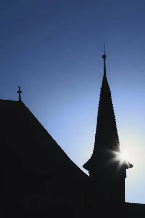 Framed Print : Sun behind church steeple, Zurich, Switzerland