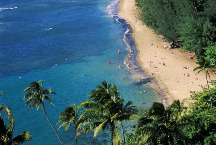 Framed Print : Sunbathers and blue Pacific waters at Ke e Beach, North Shore, Island of Kauai