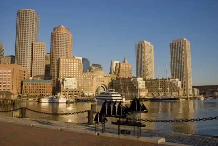 Framed Print : Sunrise on the Boston skyline from along the seawall at John Joseph Moakley Federal Courthouse