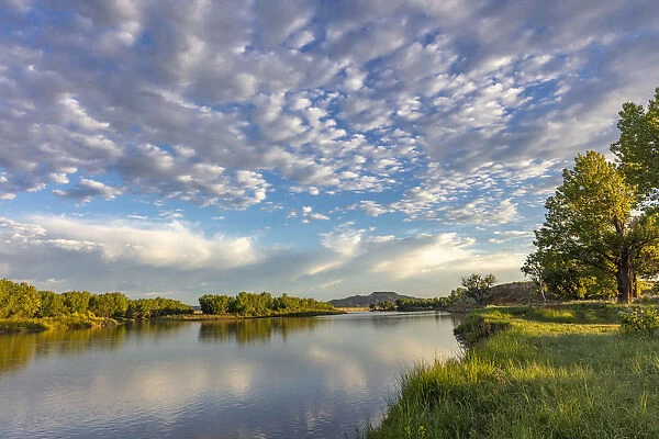 Sunrise and clouds over the Powder River near the confluence with the Yellowstone River near Terry