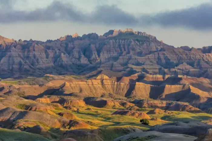Framed Print : Sunrise light breaks through on a foggy morning in Badlands National Park, South Dakota Framed Print : Sunrise light breaks through on a foggy morning in Badlands National Park, South Dakota
