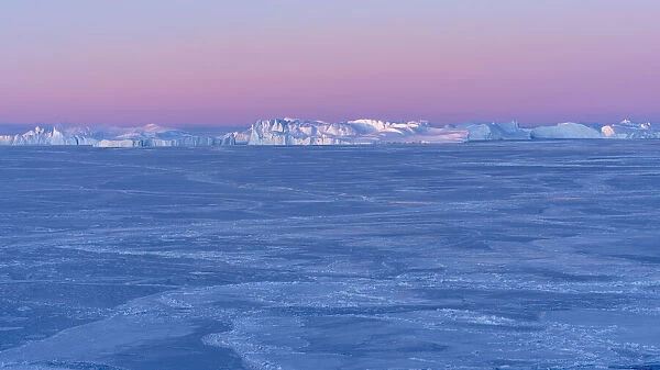 Sunrise during winter at the Ilulissat Fjord, located in the Disko Bay in West Greenland