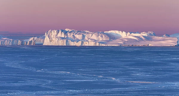 Sunrise during winter at the Ilulissat Fjord, located in the Disko Bay in West Greenland