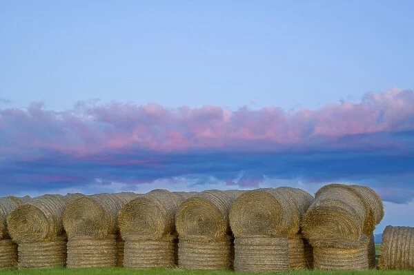 Sunset clouds over stack of hay bales near Lewistown Montana