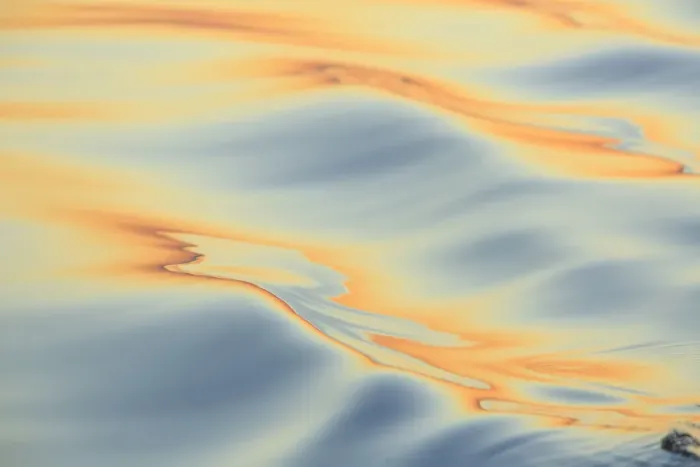 Framed Print : Sunset colors and patterns on small waves in water Framed Print : Sunset colors and patterns on small waves in water