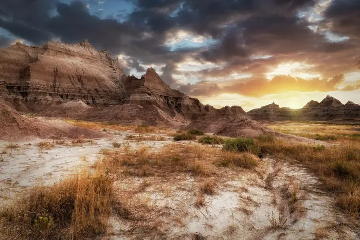 Framed Print : Sunset in dramatic skies over the hoodoo peaks of the Badlands Framed Print : Sunset in dramatic skies over the hoodoo peaks of the Badlands