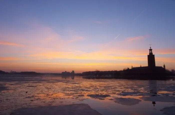 Framed Print : Sunset over an ice covered Riddarfjarden water towards the west with Kungsholmen
