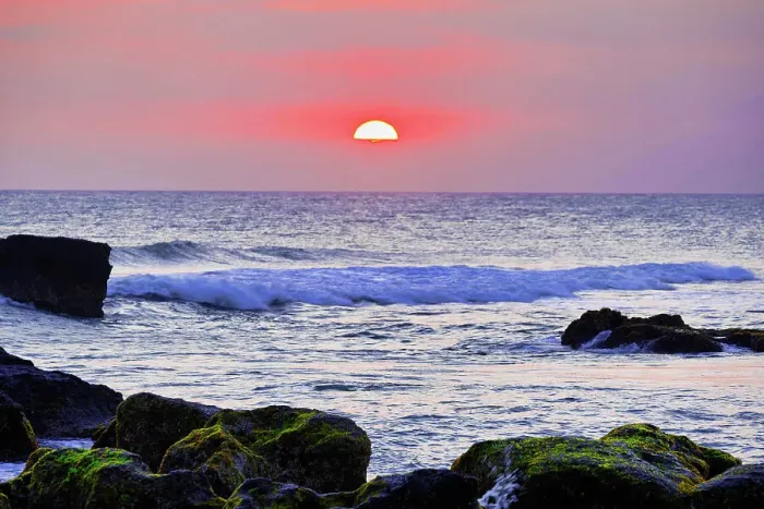 Framed Print : Sunset on the Indian Ocean with lava rock islets in the foreground