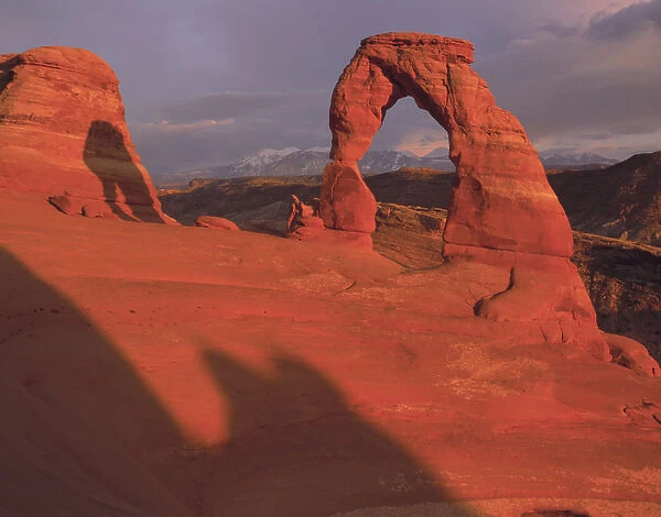 Sunset light on Delicate Arch wit the La Sal Mountains in the background, Arches nat l Park