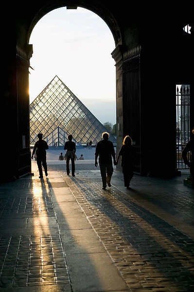 Sunset behind the Louvre Pyramid, Paris, France
