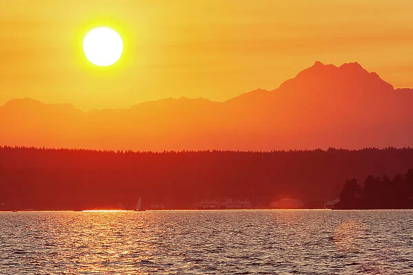Sunset over Puget Sound, Seattle, Washington State. Silhouette of The Brothers peak on the right