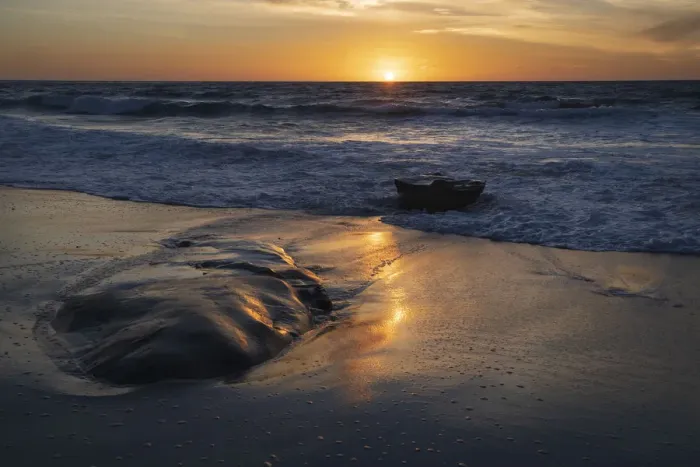 Framed Print : Sunset reflecting off the water on the sand of a beach Framed Print : Sunset reflecting off the water on the sand of a beach