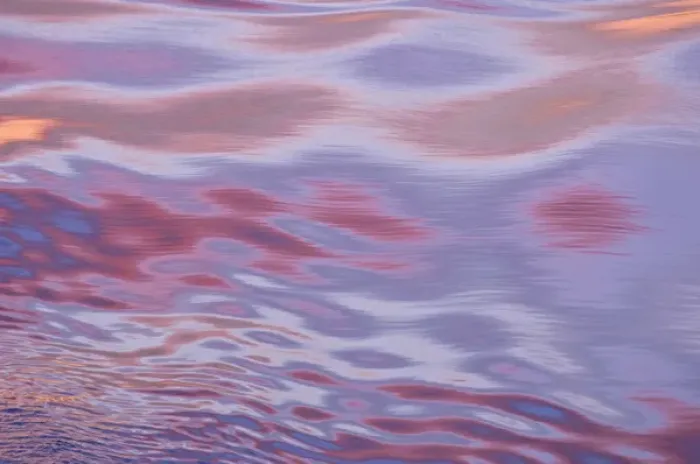 Framed Print : Sunset reflections; the movement of the water caused by the ship created this amazing mix of light