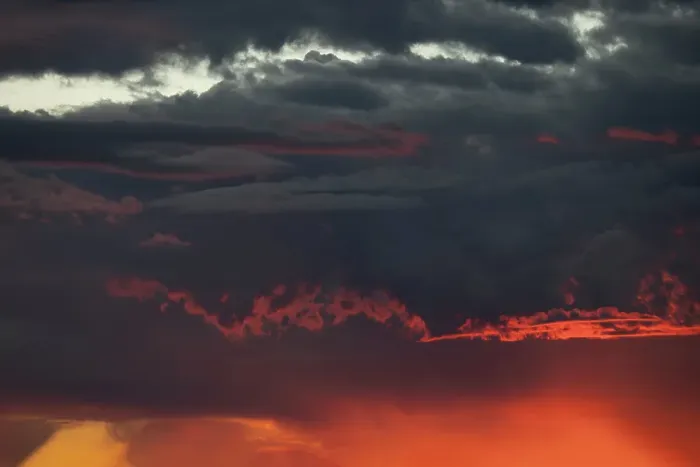 Framed Print : Sunset turns cumulus clouds bright red and orange