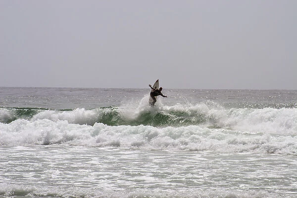 Surfing along Carmel Coastline, California
