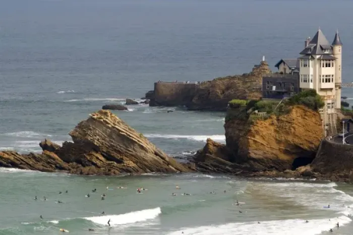 Framed Print : Surfing Cote de Basque below a castle in the Bay of Biscay at the town of Biarritz