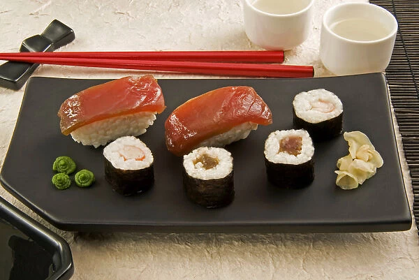 Sushi (Nigiri with salmon and Norimaki with rice, algae and fish), wasabi cream