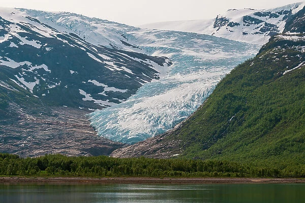 Svartisen glacier of the Svartisen ice cap flows toward Holandsfjorden. Saltfjellet-Svartisen National Park, Svartisen, Norway
