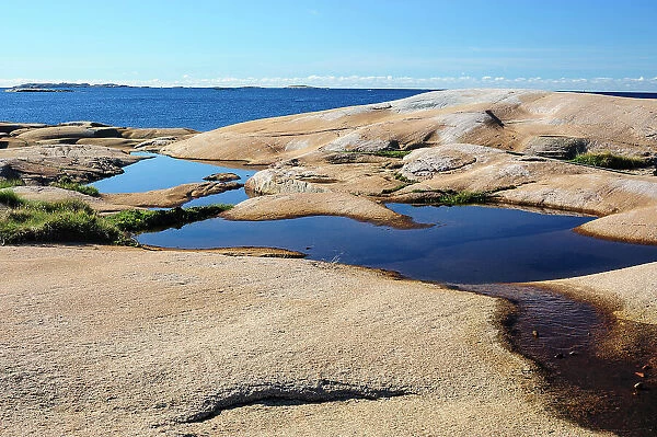Sweden, Bohuslan, Ramsviklandet Nature Preserve. Polished rock slabs along the coast
