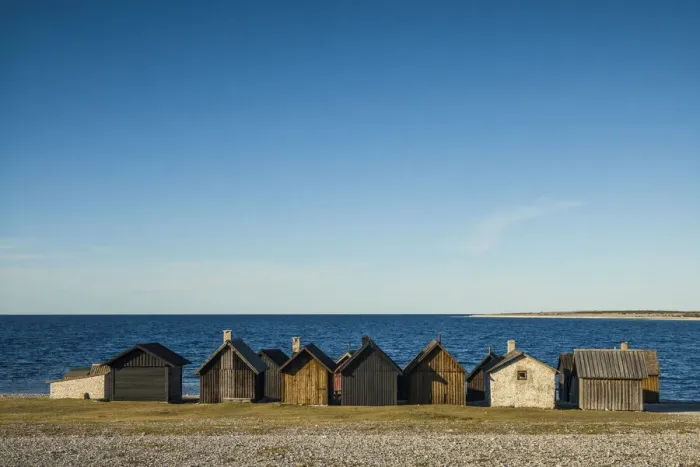 Framed Print : Sweden, Faro Island, Kursviken, coastal farmers fishing shacks, sunset
