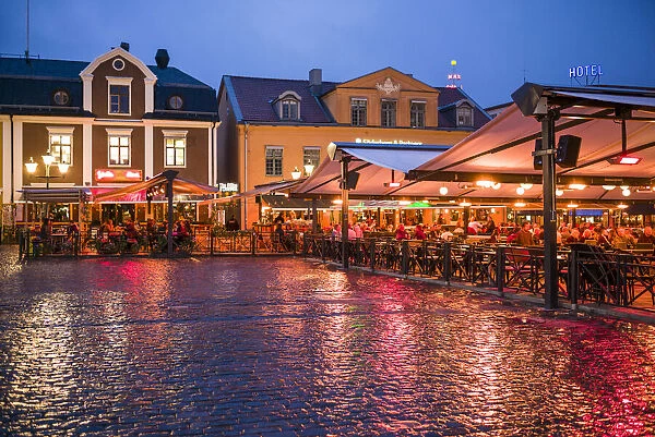 Sweden, Linkoping, cafes and bars on Stora target square, dusk