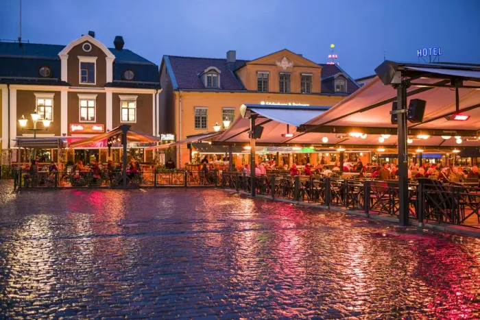 Framed Print : Sweden, Linkoping, cafes and bars on Stora target square, dusk Framed Print : Sweden, Linkoping, cafes and bars on Stora target square, dusk