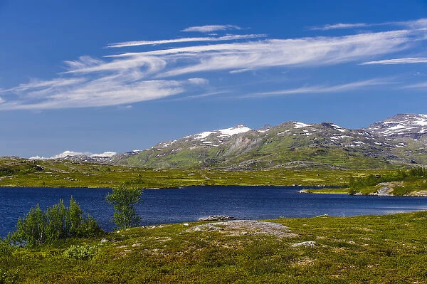 Sweden, Norrbotten. Alpine lake and high cirrus clouds