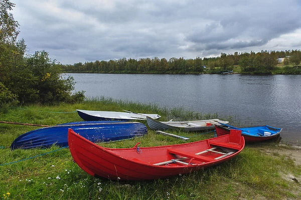 Sweden, Norrbotten. Boats along the Laino River in Lannavaara