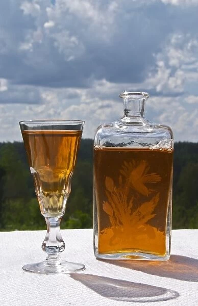 Swedish traditional aquavit schnapps glass filled to the brim with spiced vodka, brannvin