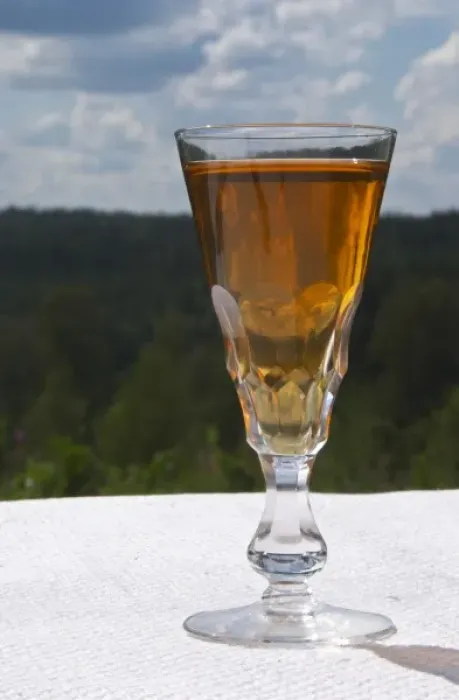 Framed Print : Swedish traditional aquavit schnapps glass in pointed form filled to the brim with spiced vodka Framed Print : Swedish traditional aquavit schnapps glass in pointed form filled to the brim with spiced vodka