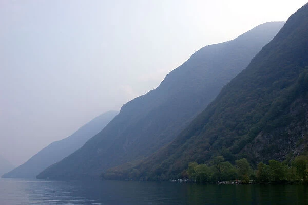 05. Switzerland, Lugano, Lake Lugano, lakeside mountains in morning