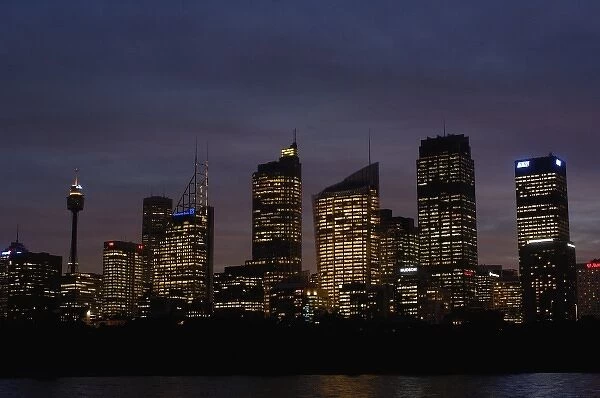 Sydney skyline at night with the Sydney Harbour in the foreground. Sydney. NSW. AUSTRALIA