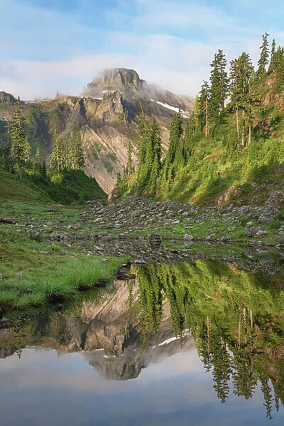 Table Mountain reflected in Bagley Lake. Heather Meadows, Mount Baker Snoqualmie National Forest. North Cascades, Washington State