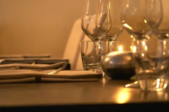 Framed Print : Table set with napkins wine glasses and forks at the trendy restaurant Beluga Framed Print : Table set with napkins wine glasses and forks at the trendy restaurant Beluga