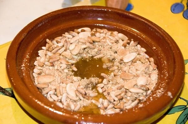 Tangier Morocco honey and almond dessert in a clay dish at a restaurant