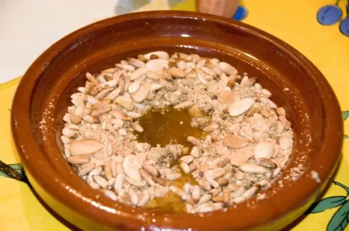 Framed Print : Tangier Morocco honey and almond dessert in a clay dish at a restaurant Framed Print : Tangier Morocco honey and almond dessert in a clay dish at a restaurant