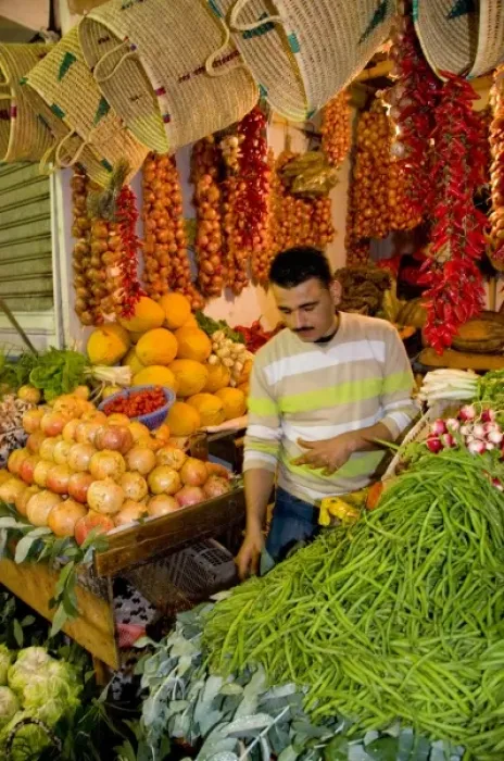 Framed Print : Tangier Morocco Moroccan fruit & vegetable seller in stall at the covered market Framed Print : Tangier Morocco Moroccan fruit & vegetable seller in stall at the covered market