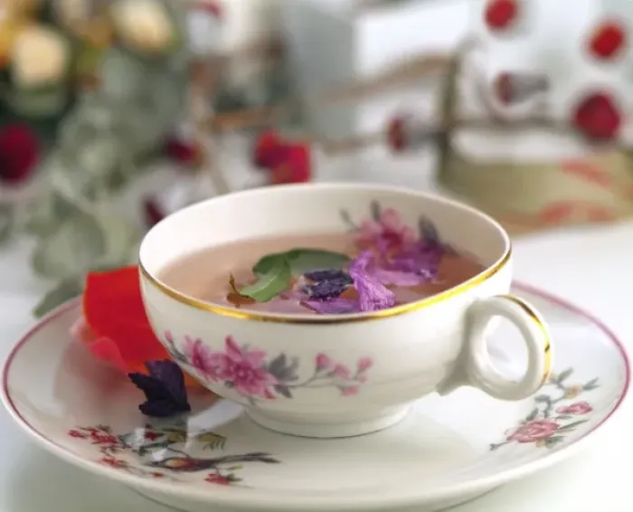 Framed Print : Tea cup with flowers and herbs Framed Print : Tea cup with flowers and herbs