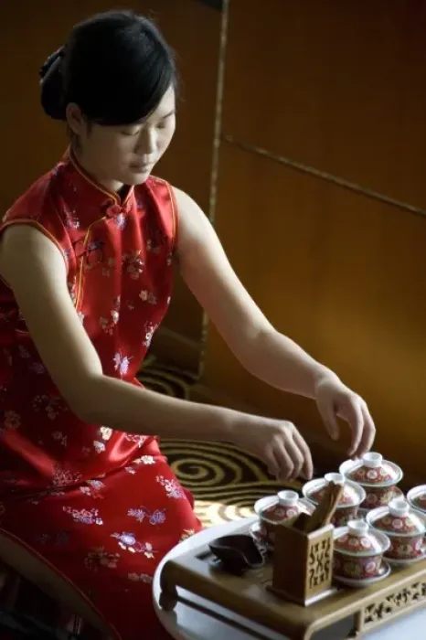 Framed Print : Tea hostess prepares for a Chinese tea tasting aboard a luxury Yangzi River cruise ship Framed Print : Tea hostess prepares for a Chinese tea tasting aboard a luxury Yangzi River cruise ship
