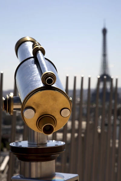 The telescope on the top of Arc de Triomphe with Eiffel Tower in the background. Paris