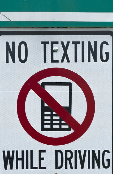 NO TEXTING WHILE DRIVING sign dangerous practice